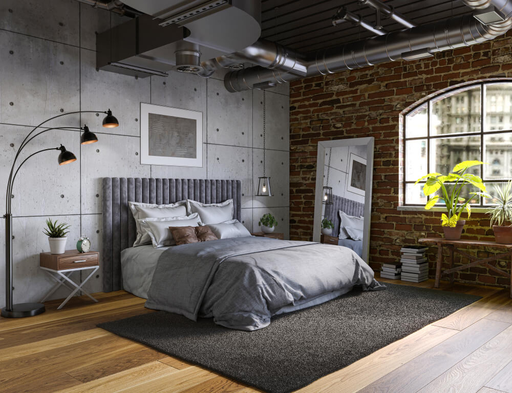 sypialnia loftowa z betonową ścianą
